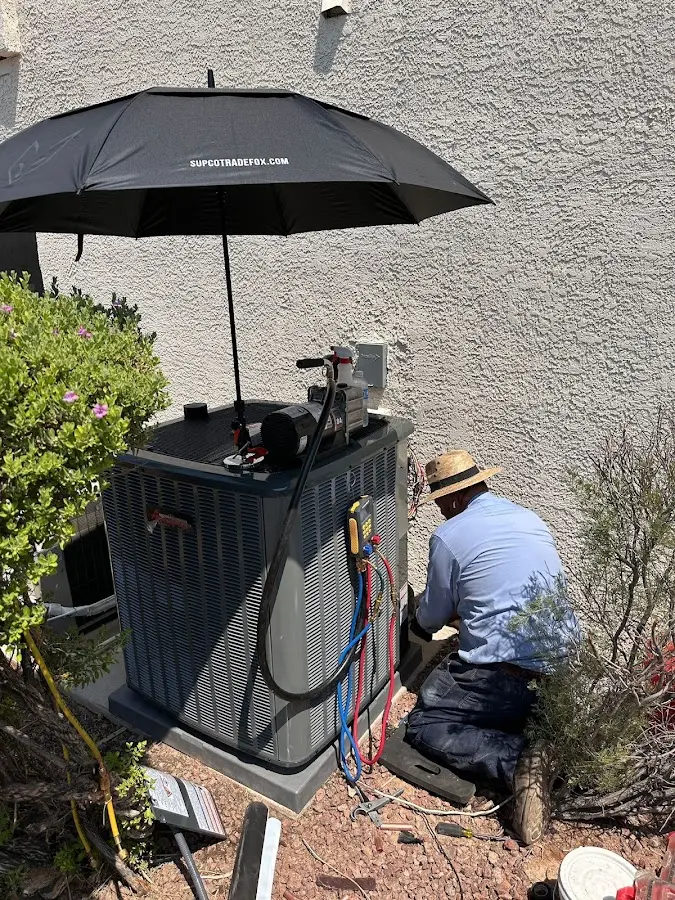 HVAC technician performing outdoor AC maintenance in Longswamp